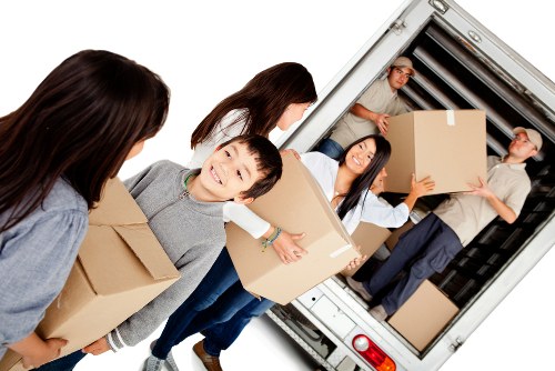 Professional movers handling sensitive business assets during a Peckham move