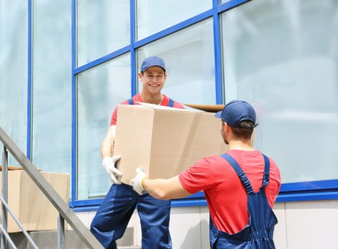 Staff member following safe manual handling practices