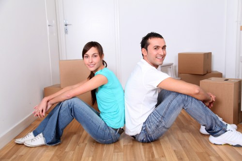 Trained removal staff carrying furniture with care in Peckham