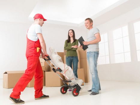 Mover assessing risks and securing furniture inside the van