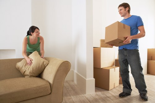 Unpacking boxes in a new Peckham home with organized room placement
